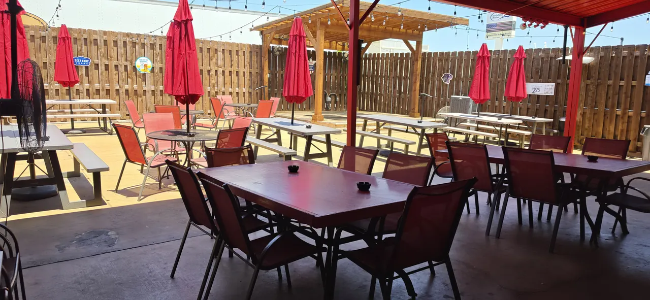 Tumbleweeds outdoor patio with tables, umbrellas and covered seating